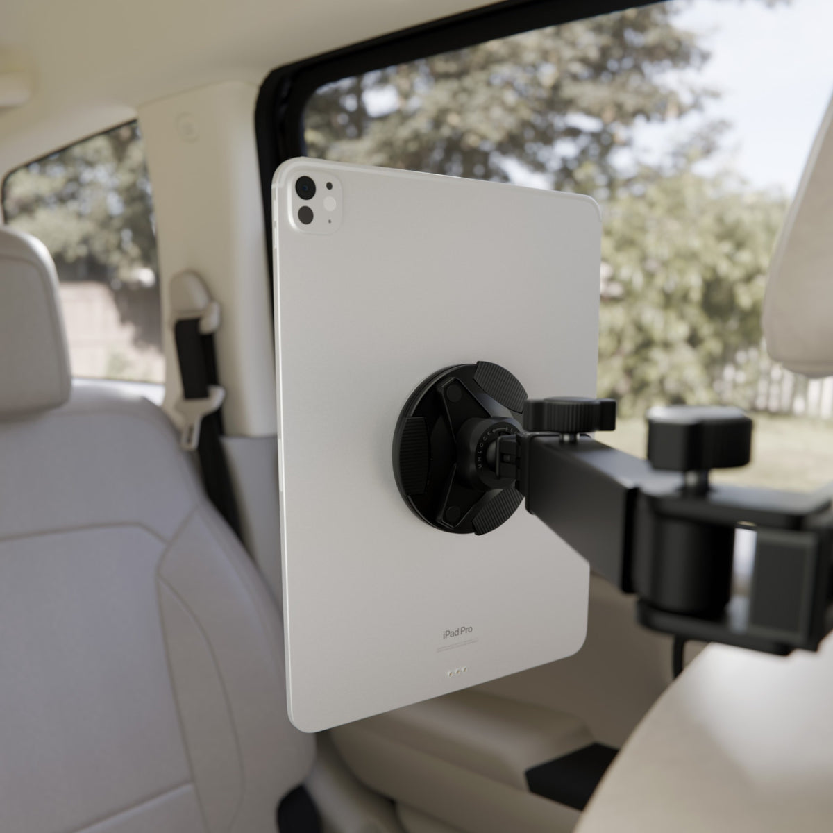 iPad Pro held on the Back Seat Mount by magnets and suction